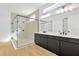 Bathroom boasts double vanity, large shower, and modern fixtures at 32354 Wetland Bird Vw, San Antonio, FL 33576