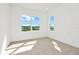 Bright bedroom with neutral carpeting and large windows at 32354 Wetland Bird Vw, San Antonio, FL 33576