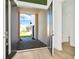 Modern entryway with double doors opening to a courtyard and light-filled interior at 32354 Wetland Bird Vw, San Antonio, FL 33576
