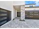 Home features a two-car garage and walkway at 32354 Wetland Bird Vw, San Antonio, FL 33576