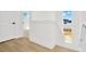 Bright hallway with light wood floors and access to other rooms at 32354 Wetland Bird Vw, San Antonio, FL 33576