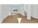 Bright landing with hardwood floors and staircase at 32354 Wetland Bird Vw, San Antonio, FL 33576