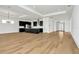 Open living room with hardwood floors and kitchen views at 32354 Wetland Bird Vw, San Antonio, FL 33576