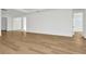 Spacious living room featuring light hardwood floors at 32354 Wetland Bird Vw, San Antonio, FL 33576