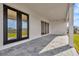 Covered patio with access to the backyard at 32354 Wetland Bird Vw, San Antonio, FL 33576