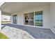 Covered patio with view of kitchen and lake at 32354 Wetland Bird Vw, San Antonio, FL 33576