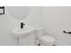 Powder room with pedestal sink and toilet at 32354 Wetland Bird Vw, San Antonio, FL 33576