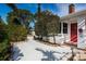 White house with red door and walkway, surrounded by landscaping at 3501 63Rd N St, St Petersburg, FL 33710