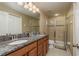Bathroom boasts granite countertops, double sinks, and a shower at 5162 Bay Isle Cir, Clearwater, FL 33760