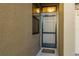 Tan front door with a screen door and welcome mat at 5162 Bay Isle Cir, Clearwater, FL 33760