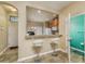 Kitchen with a breakfast bar and two bar stools at 5162 Bay Isle Cir, Clearwater, FL 33760