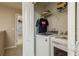 Laundry closet with washer, dryer, and shelving at 5162 Bay Isle Cir, Clearwater, FL 33760