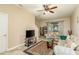 Spacious living room with beige couches and a large TV at 5162 Bay Isle Cir, Clearwater, FL 33760