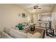 Living area with couches, coffee table, and view into the kitchen at 5162 Bay Isle Cir, Clearwater, FL 33760