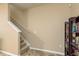 Staircase with carpeted steps and neutral-colored walls at 5162 Bay Isle Cir, Clearwater, FL 33760