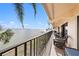 Relaxing balcony with water views and wicker chairs at 7540 Sunshine Skyway S Ln # 220, St Petersburg, FL 33711