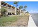 Building exterior showing multiple units and water views at 7540 Sunshine Skyway S Ln # 220, St Petersburg, FL 33711