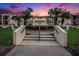 Condo building entrance with landscaped grounds and walkway at 7540 Sunshine Skyway S Ln # 220, St Petersburg, FL 33711