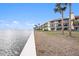 Condo building with stunning waterfront views and landscaping at 7540 Sunshine Skyway S Ln # 220, St Petersburg, FL 33711