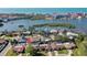 Aerial view showing home's location in waterfront community near canals at 8134 Bayshore Dr, Seminole, FL 33776