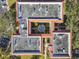 Overhead aerial view shows the buildings layout including a courtyard and surrounding trees at 2650 Pearce Dr # 301, Clearwater, FL 33764