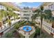 Courtyard view with a fountain, palm trees, and other foliage at the center of the building at 2650 Pearce Dr # 301, Clearwater, FL 33764