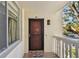 Condo front door features decorative details, secure entry, and welcome mat at 2650 Pearce Dr # 301, Clearwater, FL 33764