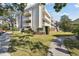 Picture of the side exterior of the condo, with balconies and green space at 2650 Pearce Dr # 301, Clearwater, FL 33764