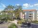 Stunning exterior view of condo building boasting well maintained landscaping and ample parking at 2650 Pearce Dr # 301, Clearwater, FL 33764