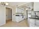 Bright kitchen features modern appliances, ample cabinet space, and tile floors at 2650 Pearce Dr # 301, Clearwater, FL 33764