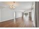 Open living room with beautiful hardwood floors and natural light from sliding glass doors at 2650 Pearce Dr # 301, Clearwater, FL 33764