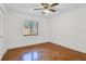 Bright bedroom with hardwood floors and a ceiling fan at 3714 Greenery Ct # 214, Tampa, FL 33618
