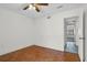 Bedroom with hardwood floors and access to hallway at 3714 Greenery Ct # 214, Tampa, FL 33618