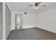 Bedroom with ceiling fan and view of hallway at 3714 Greenery Ct # 214, Tampa, FL 33618