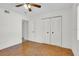 Bright bedroom with wood flooring and double door closet at 3714 Greenery Ct # 214, Tampa, FL 33618