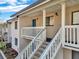 Exterior view of condo building showcasing stairs and entrance at 3714 Greenery Ct # 214, Tampa, FL 33618
