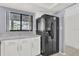 Kitchen with black refrigerator and white cabinets at 3714 Greenery Ct # 214, Tampa, FL 33618