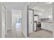 Bright kitchen with stainless steel appliances and white cabinets at 3714 Greenery Ct # 214, Tampa, FL 33618