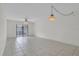 Bright living room featuring tile floors and a ceiling fan at 3714 Greenery Ct # 214, Tampa, FL 33618
