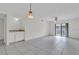 Spacious living room with tile floors and sliding glass doors at 3714 Greenery Ct # 214, Tampa, FL 33618
