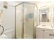 Bathroom featuring tile floors, a vanity, a toilet, and a glass-door shower at 801 83Rd N Ave # 511, St Petersburg, FL 33702
