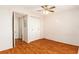 Bedroom featuring tile floors, a closet, and a ceiling fan at 801 83Rd N Ave # 511, St Petersburg, FL 33702