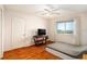 Bedroom featuring tile floors, a TV on a table, and a view out the window at 801 83Rd N Ave # 511, St Petersburg, FL 33702