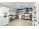 Well-maintained laundry room with stainless steel machines, folding table, and festive holiday decor at 801 83Rd N Ave # 511, St Petersburg, FL 33702