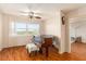 A well lit living room with hardwood floors and a grand piano at 801 83Rd N Ave # 511, St Petersburg, FL 33702