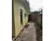Backyard with hexagonal patio and exterior door at 105 Causeway Blvd, Belleair Beach, FL 33786