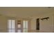 Bright living room with large windows and doors at 105 Causeway Blvd, Belleair Beach, FL 33786