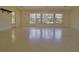 Large living area with multiple windows and doors at 105 Causeway Blvd, Belleair Beach, FL 33786