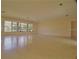 Spacious living room with large windows and doors at 105 Causeway Blvd, Belleair Beach, FL 33786