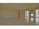 Spacious living room with sliding glass doors at 105 Causeway Blvd, Belleair Beach, FL 33786